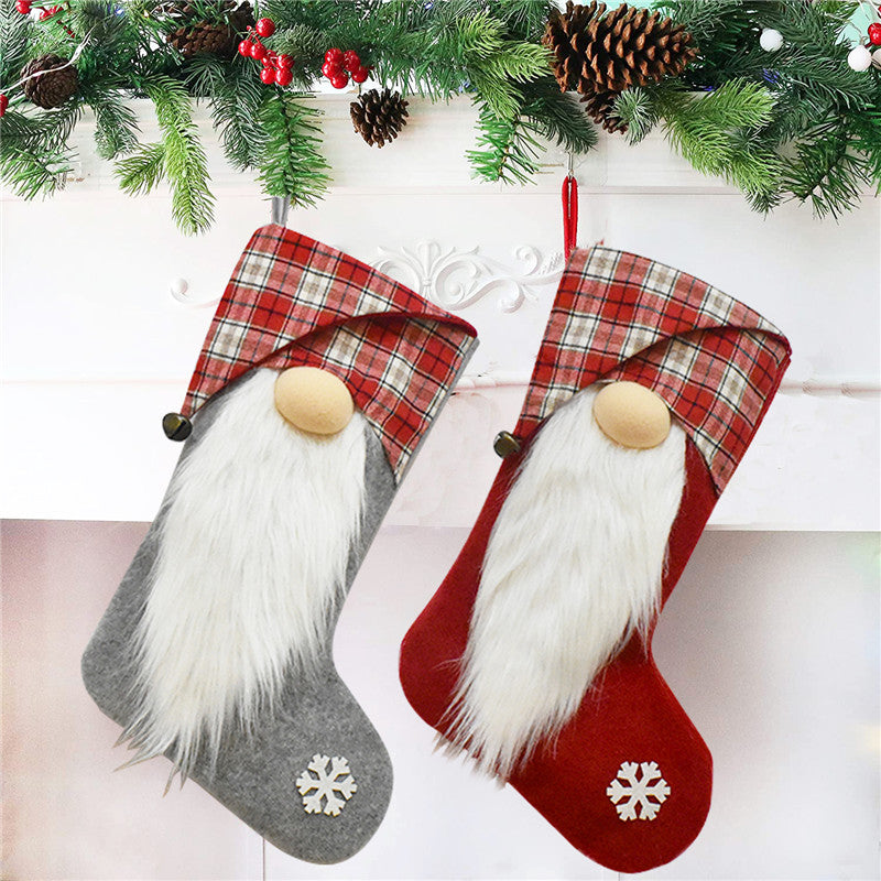 ELITE CASA Christmas stockings hanging on a fireplace, featuring a gnome design and festive colors.
